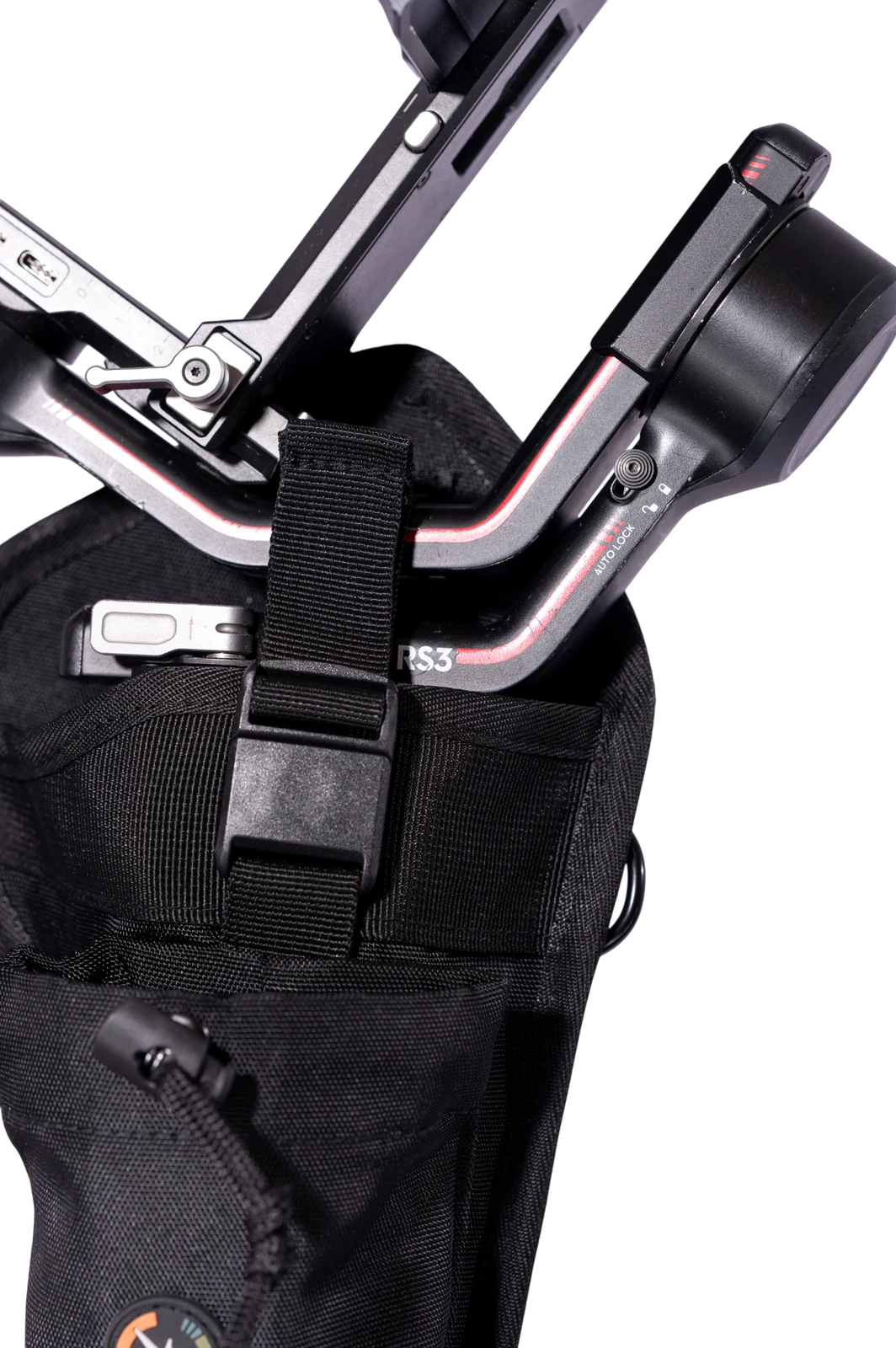 Close-up of the magnetic latch strap locked over a DJI RS3