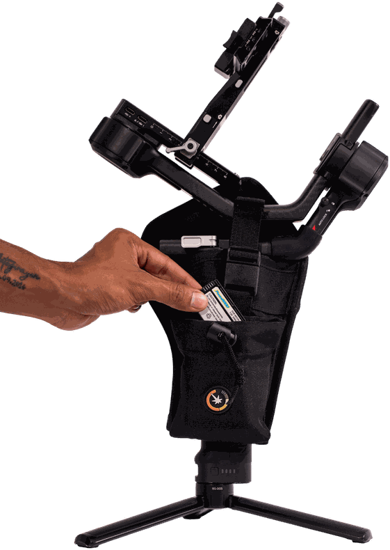 Hand loading a battery into the holster front pocket