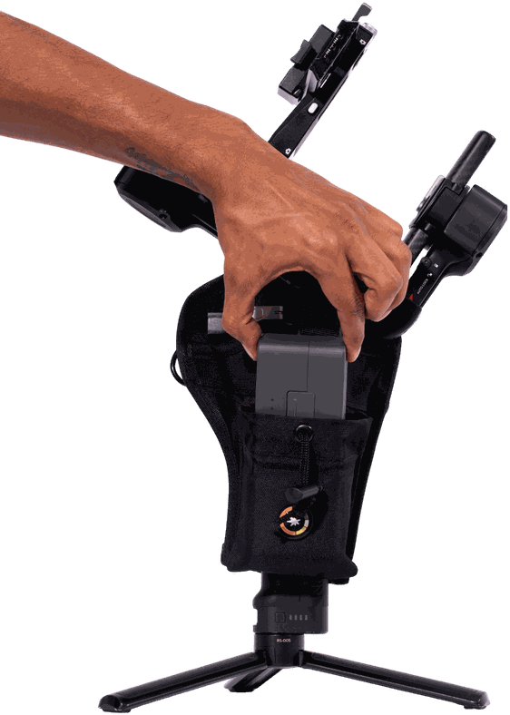 Hand loading a battery into the front utility pocket